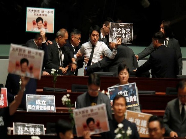 Hong Kong council session adjourns as pro-democracy lawmakers heckle Carrie Lam