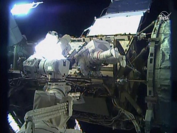 Spacewalking astronauts close to fixing cosmic ray detector