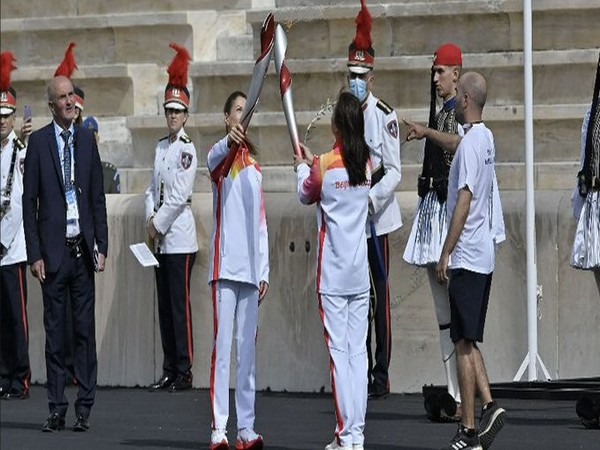 Winter Olympics flame on its way from Rome to Beijing