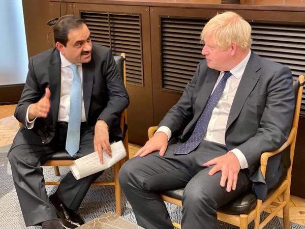 Gautam Adani meets UK PM Johnson in London, assures to commit USD 70 bn for clean energy