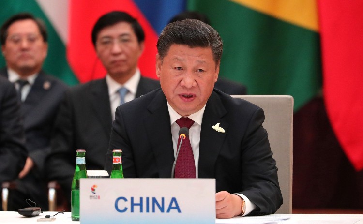 China's Xi says country will stay on path of peaceful development