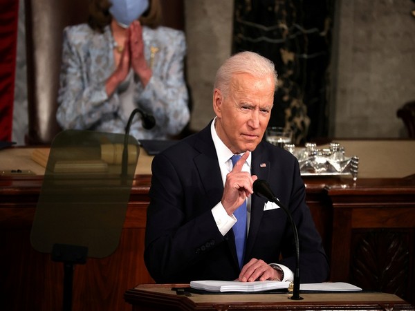 Biden notes US virus deaths approaching 600K