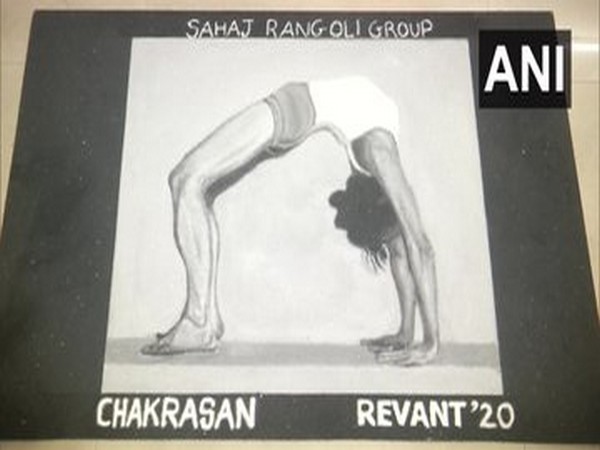 Artists make rangolis on International Yoga Day in Vadodara