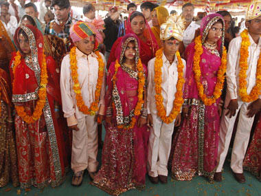 FEATURE-Wedded to debt: Fathers of Indian child brides trapped in bondage