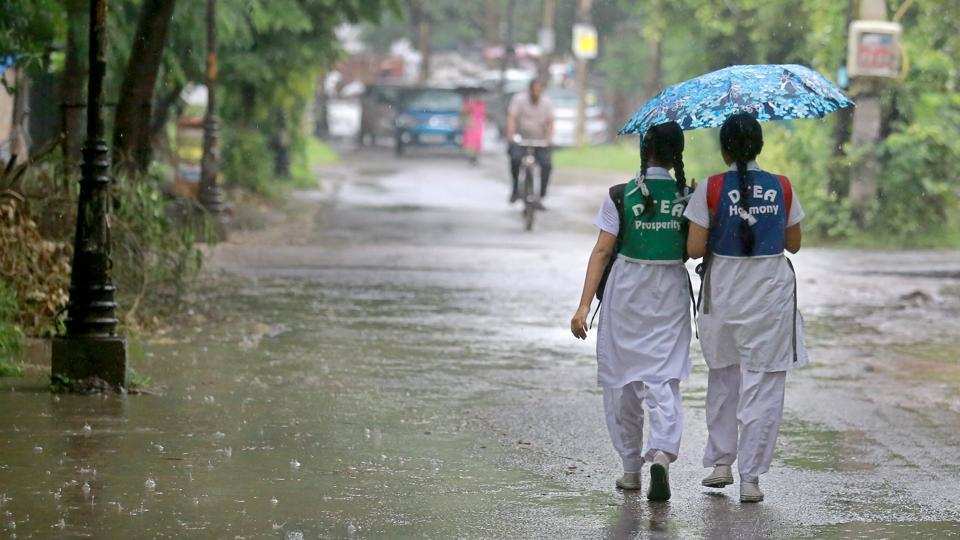 Delhi grapples in light rain with temp dropping to 22 degrees C