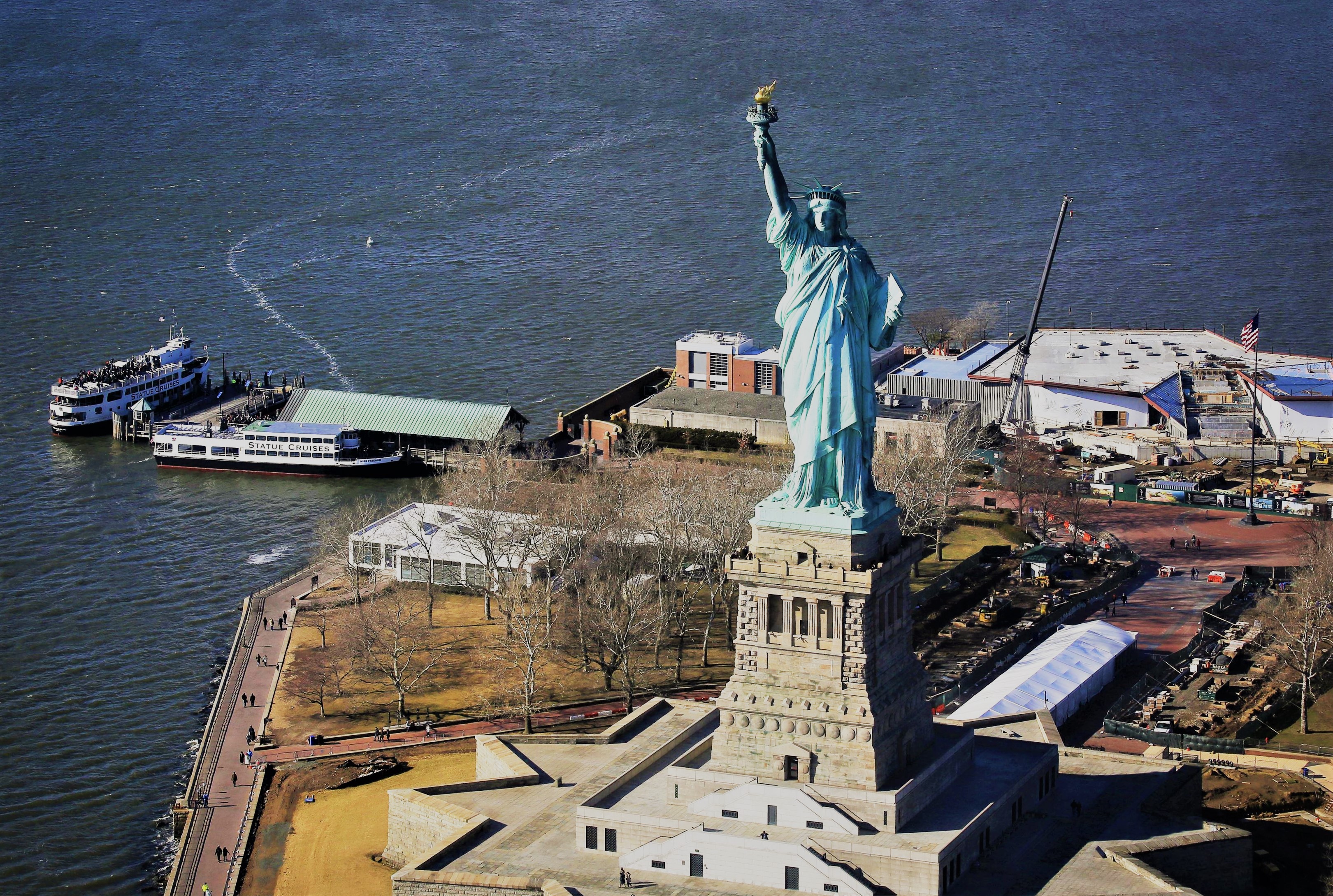 Humpback whale in New York Harbor ready for closeup at Statue of