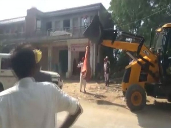 Rajasthan: Woman sarpanch climb over JCB machine to stop encroachment