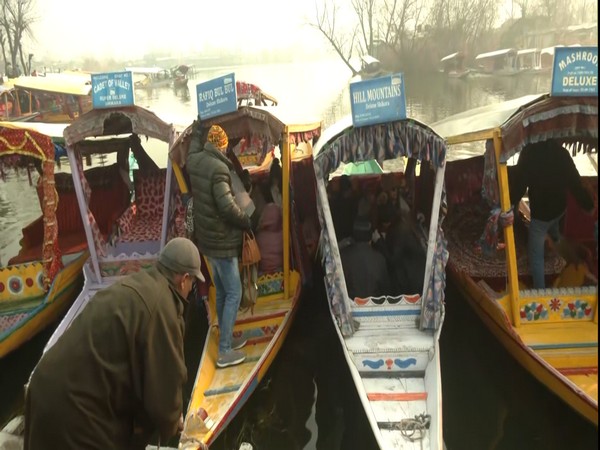 J-K: Tourists enjoying 'Shikara' ride at frozen Dal Lake