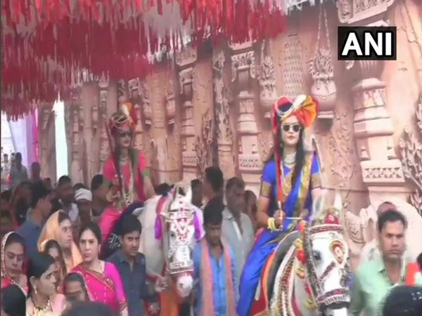 Two brides ride to their wedding venue in MP
