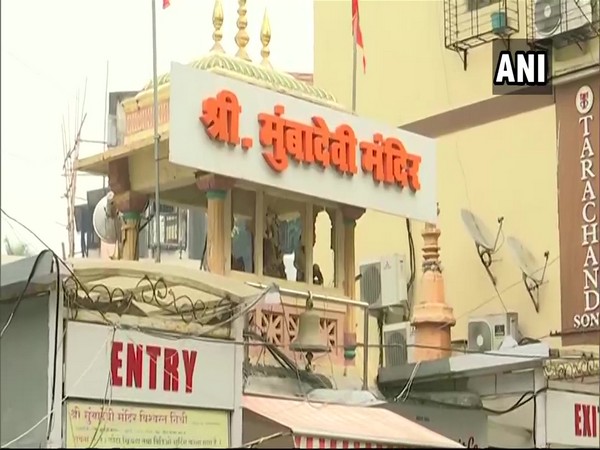 Devotees pray outside Mumba Devi temple amid pandemic restrictions