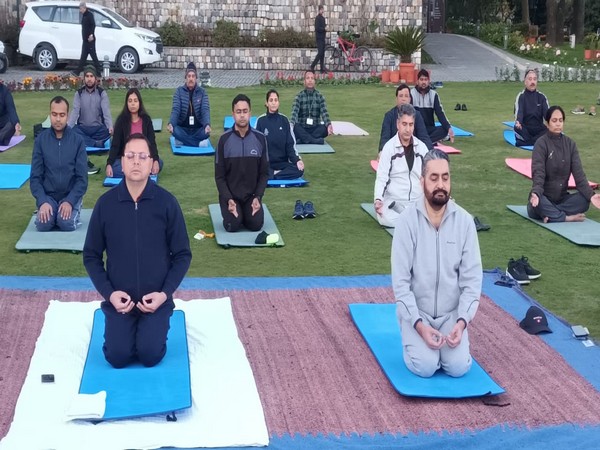 Uttarakhand CM performs yoga with administrative officials at Chintan Shivir