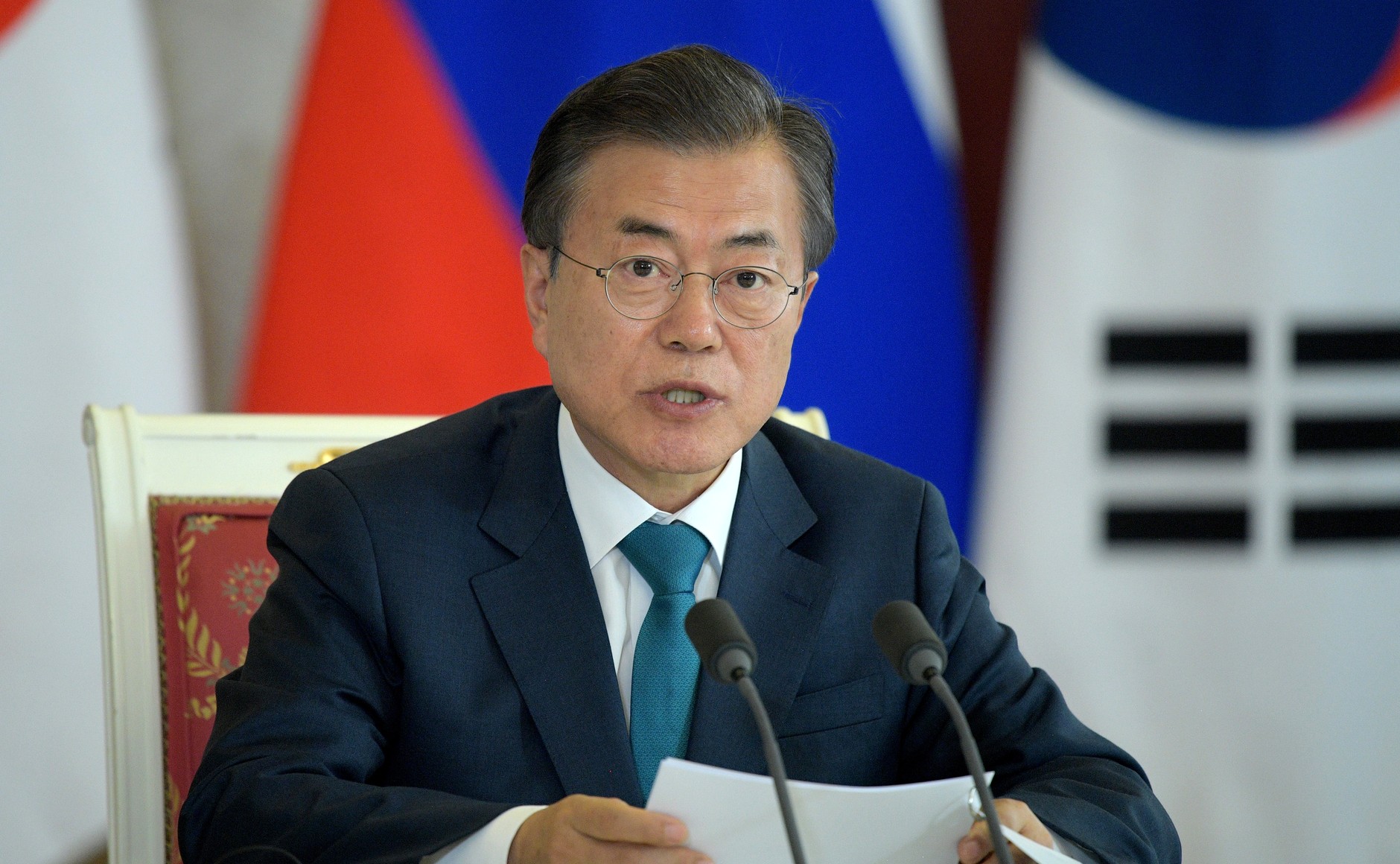 S.Korea ready for talks with Japan to improve ties, Moon tells Suga