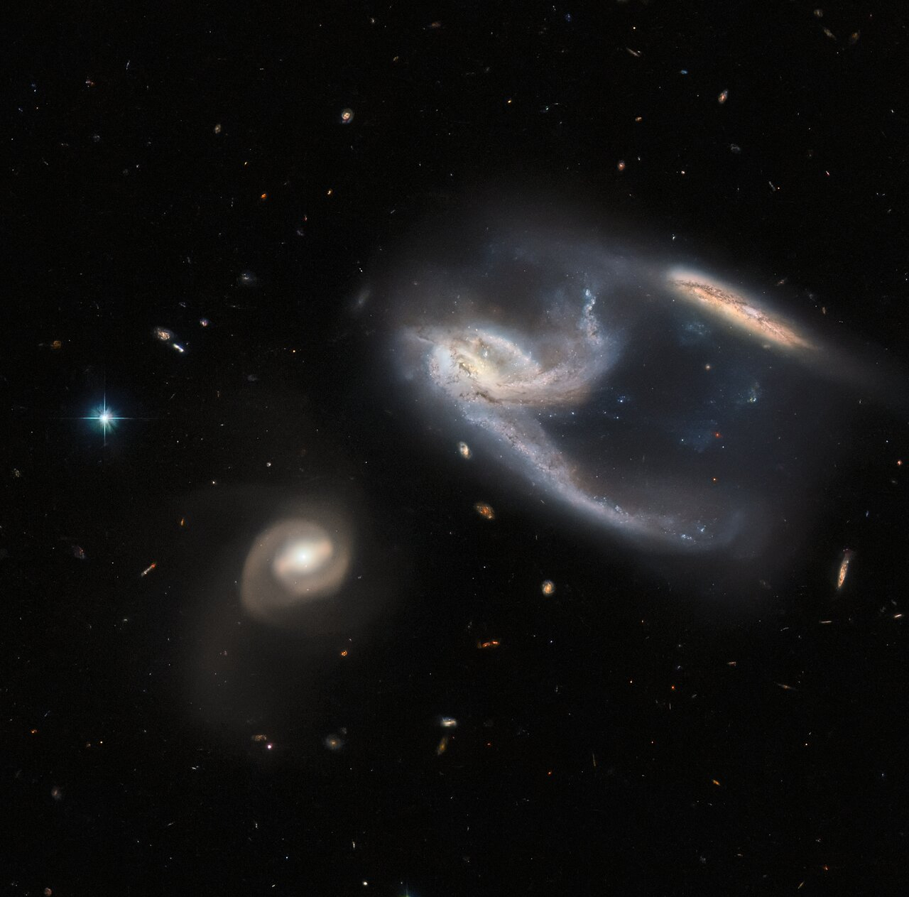 Galaxies appear to be interacting with one another in image captured by Hubble