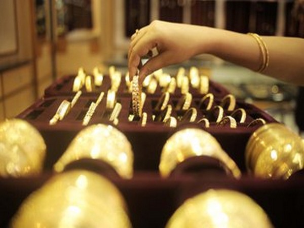 Gold declines by Rs 112, silver slides Rs 108