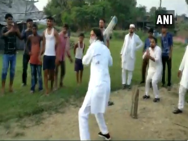 RJD leader Tej Pratap plays cricket with children in Hasanpur constituency