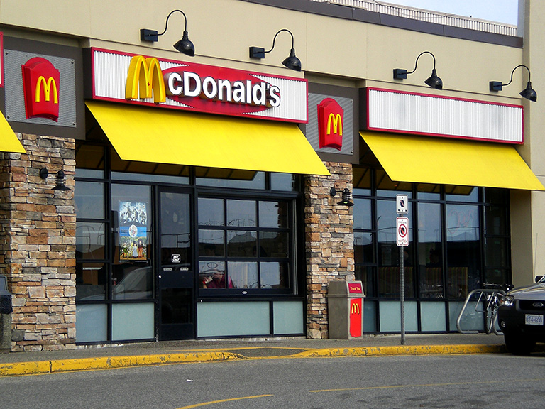 UPDATE 2-McDonald's ousts CEO over consensual relationship with employee