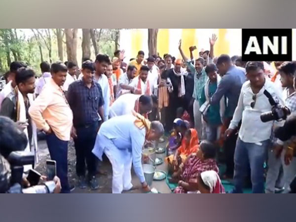 BJP's Dharmendra Pradhan serves food to party leaders, supporters