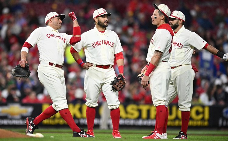 Historic outburst carries Reds past Rockies