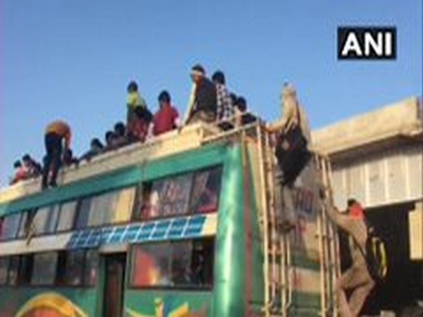 Coronavirus lockdown: Migrants walk on foot, board buses at UP's Ghaziabad