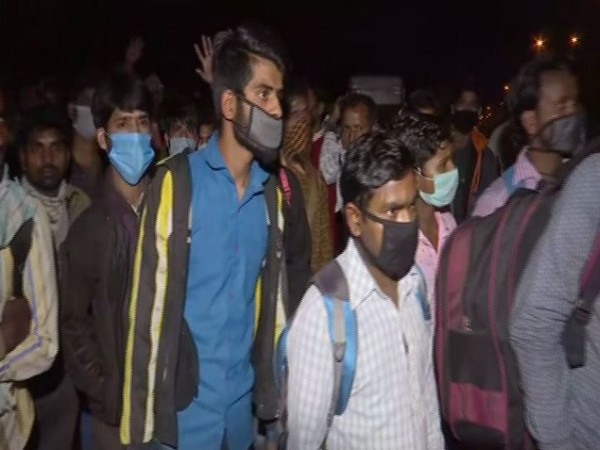 Uncertain about their future, migrants begin journey on foot to homes in UP