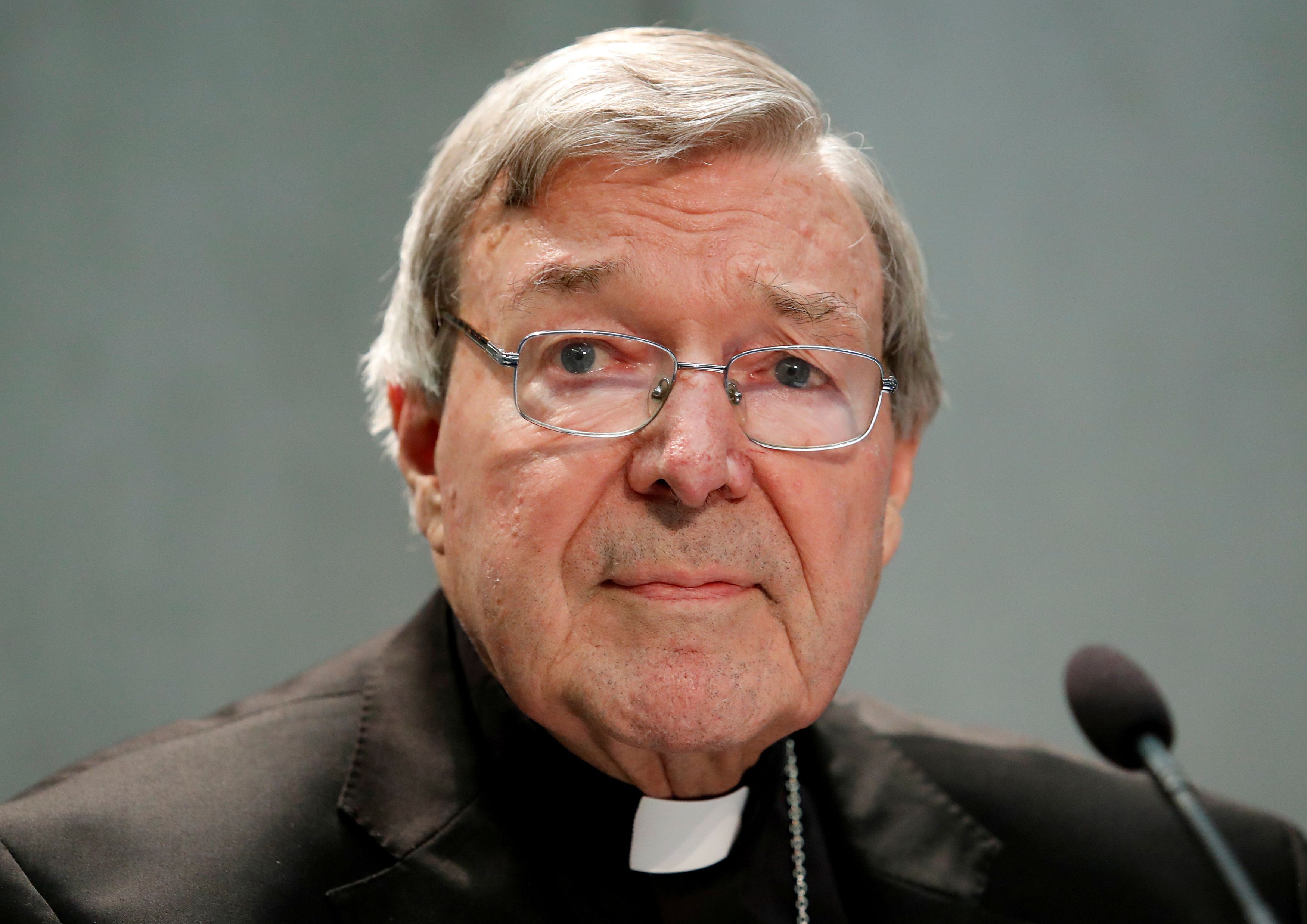 Pell mourned at Sydney cathedral, police try to stop protest