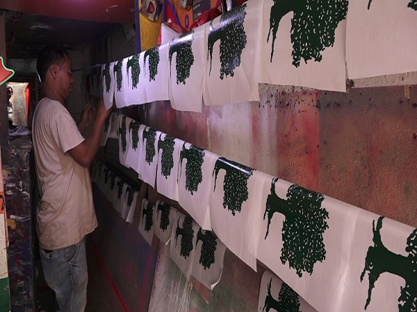 As local polls arrive in Nepal, party flags fly off shelves from shops