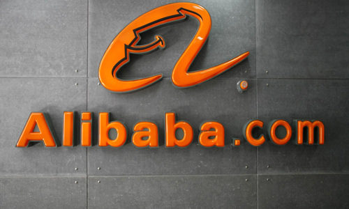 Alibaba shares surge more than 6% on Hong Kong debut