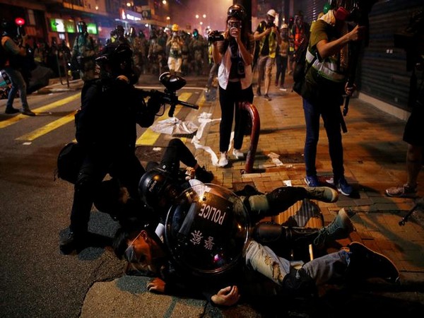 Hong Kong police fend off airport protest after night of violence