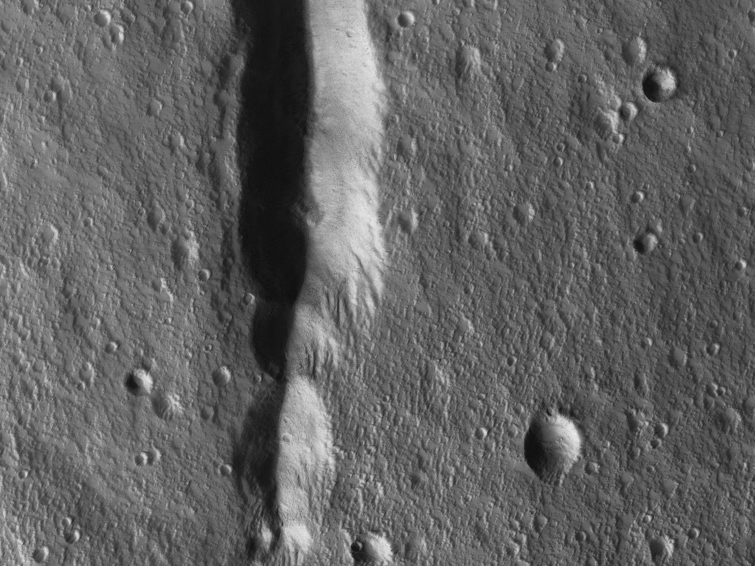 NASA's HiRISE camera captures unexpected feature on colossal volcano on Mars