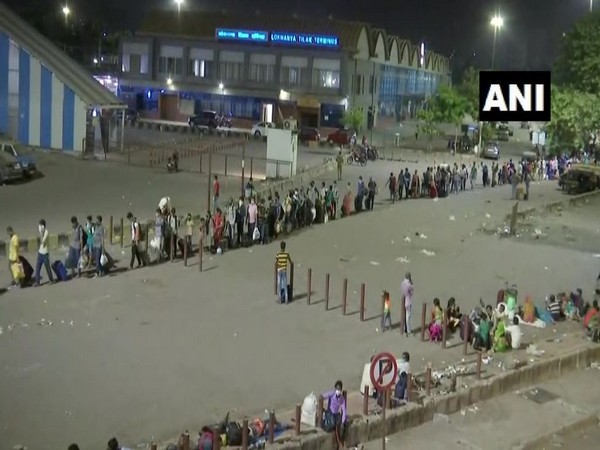 People wait for boarding 'Shramik' special trains at Mumbai's Lokmanya Tilak Terminus  