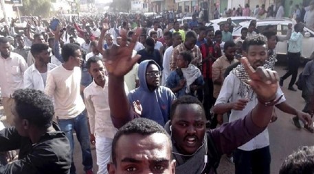 Sudanese security forces try to disperse protesters by firing shots into air